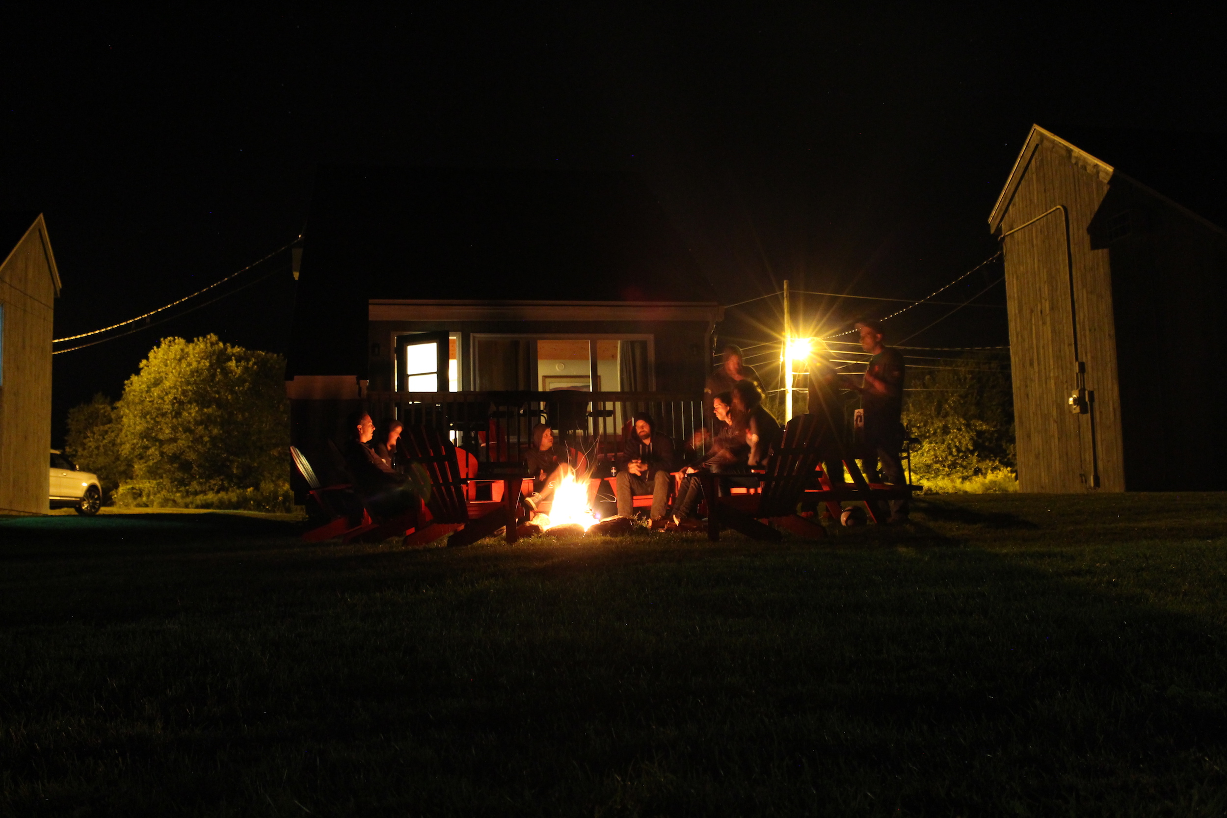 The team gathered around a bonfire